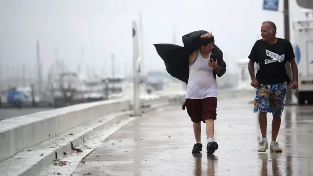 People walk through high winds in Corpus Christi