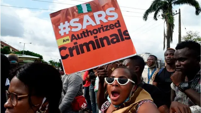 Protester carry placard