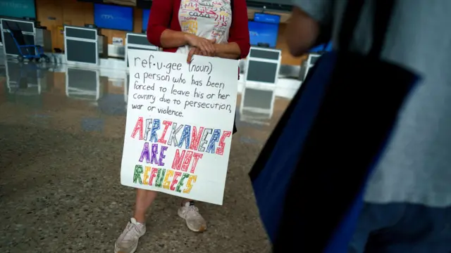 One protester hold placard for airport.