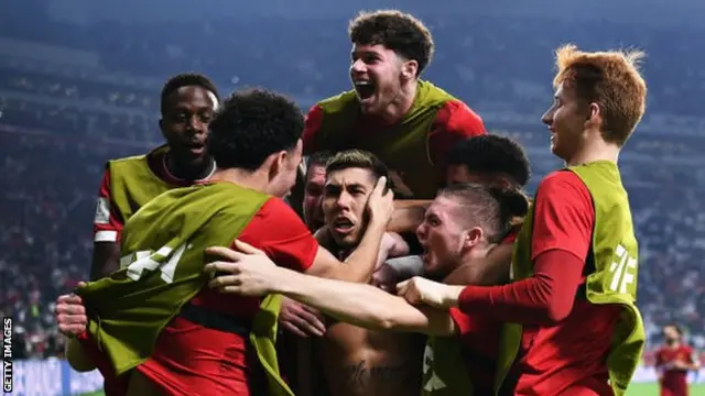 Liverpool celebrate Roberto Firmino's goal