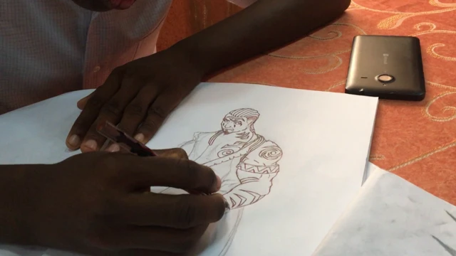A pair of hands drawing a comic character