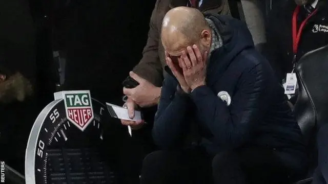 Kocha wa City Pep Guardiola akihuzunika