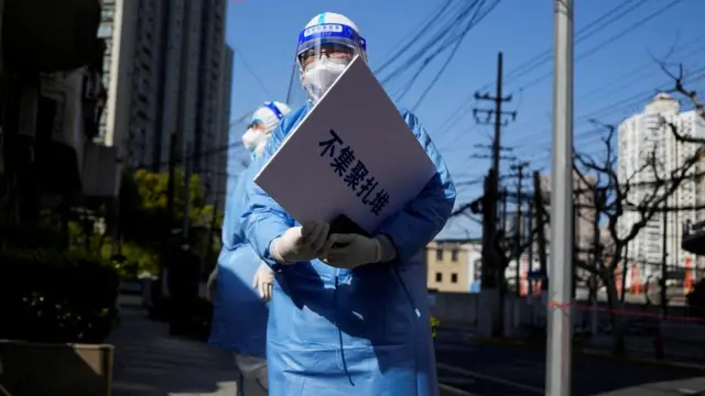 Medical worker in protective suit, Shanghai, 4 April 2022