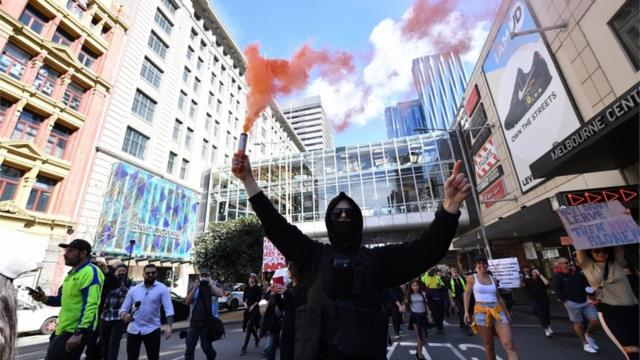 Protesters gather during an anti-lockdown protest in the central business district of Melbourne, Australia, 21 August 2021