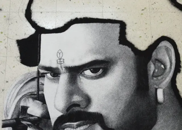 અડધી તૈયાર થયેલી રંગોળીની તસવીર