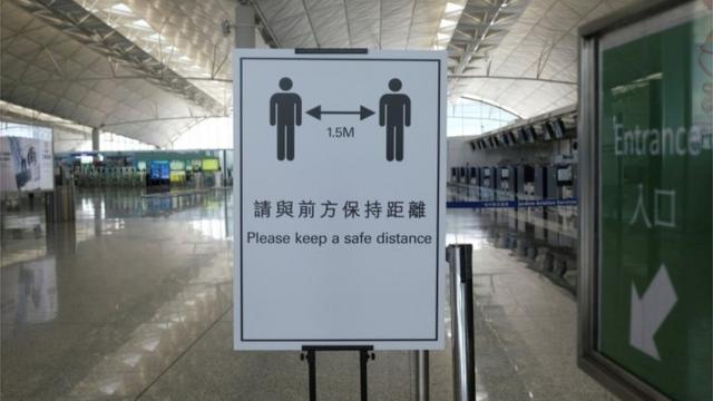 A social distancing sign is seen at the Hong Kong International Airport, following the coronavirus disease (COVID-19) outbreak, in Hong Kong, China May 7, 2020.