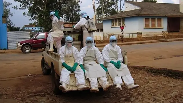 Personnel in hazard suits