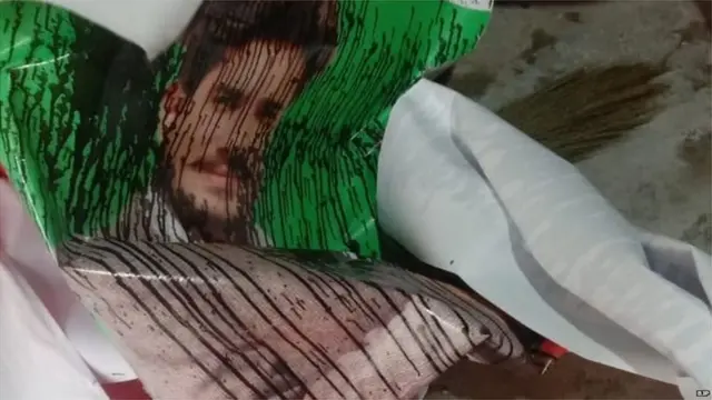 पोस्टर पर पुती कालिख