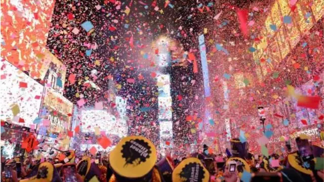 Confetti fill di air for Times Square as dem ring in 2023