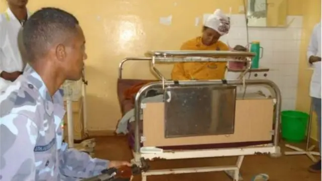 Woman sit for an exam soon after giving birth to her child