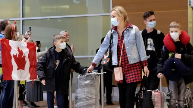 Refugees exiting airport