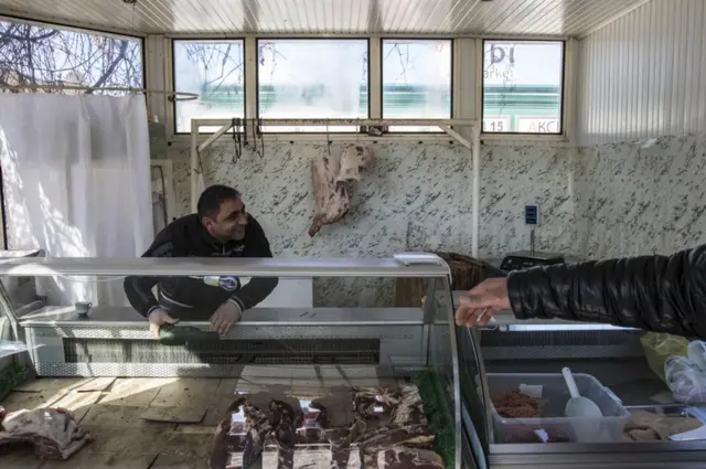 A man in his butcher's shop