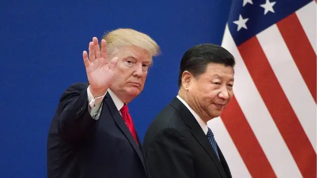 This file picture taken on November 9, 2017 shows US President Donald Trump (L) and China"s President Xi Jinping leaving a business leaders event at the Great Hall of the People in Beijing.