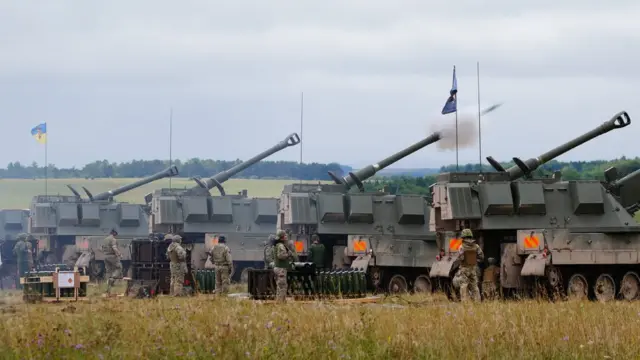 Newly trained Ukrainian artillery specialists firing British donated AS90 155mm self-propelled artillery guns under the supervision of British Army instructors as they come to the end of their training in south west England