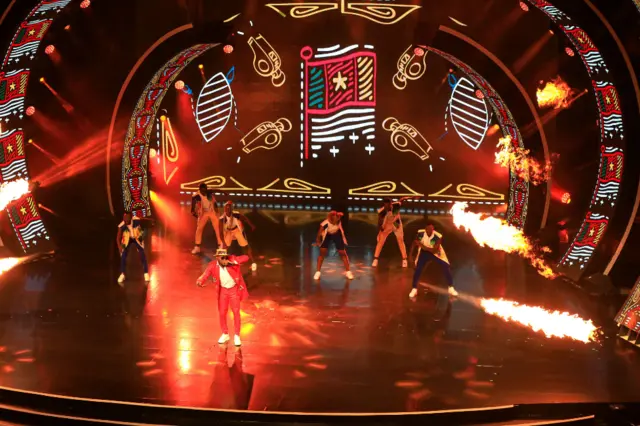 Cameroonian artist Salatiel performs a song at the opening of the draw ceremony for the 2022 African Cup of Nations (CAN) in Yaounde, Cameroon, on August 17, 2021