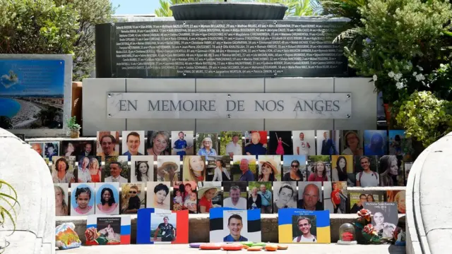 Portraits of the victims of the attack are displayed in a memorial