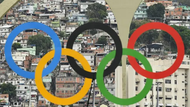Favelas are seen behind the Olympic rings on Day 5 of the Rio 2016 Olympic Games at the Sambodromo on August 10, 2016 in Rio de Janeiro, Brazil
