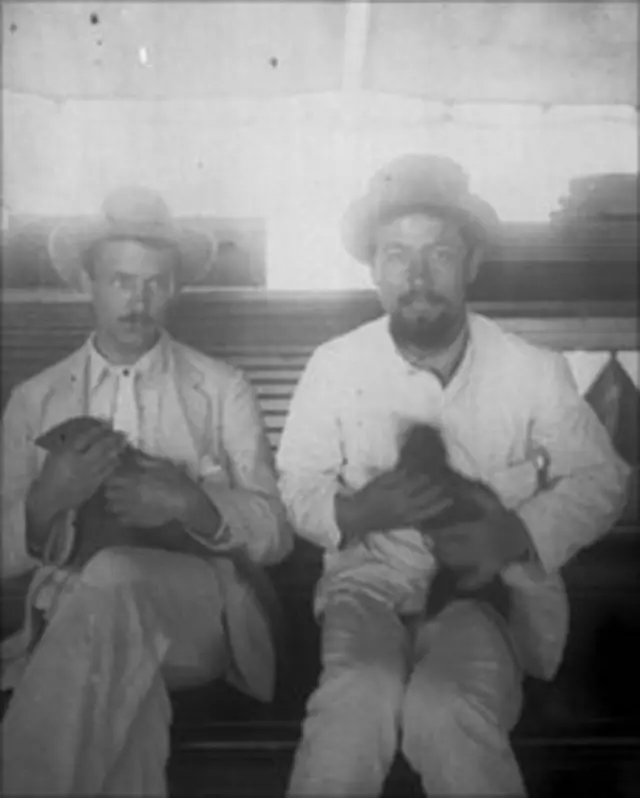 Anton Chekhov (right) with a friend cradling a Sri Lankan mongoose