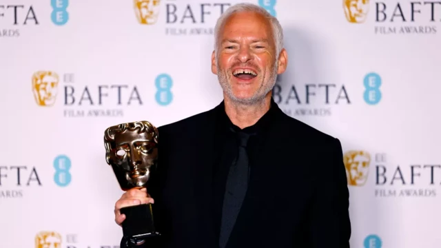 Banshees director Martin McDonagh accept di awards for outstanding British film and best original screenplay