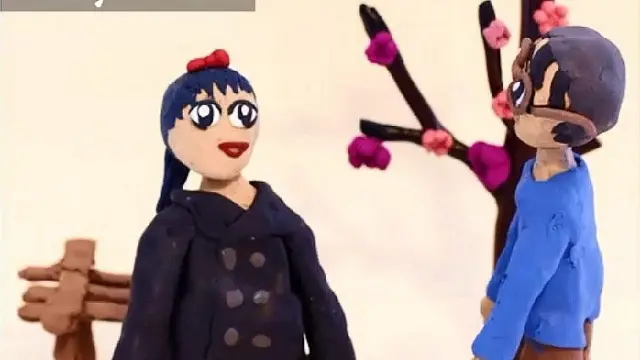 Animación de dos jóvenes al lado de un árbol