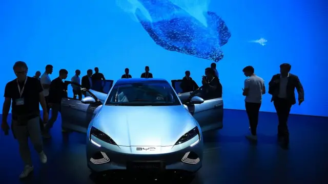 Visitors inspect a BYD Co. Seal electric sedan on day two of the Munich Motor Show (IAA) in Munich, Germany, on Wednesday, Sept. 6, 2023. Europe's automakers are showing off their latest battery-powered vehicles at the IAA Mobility car show this week as they try to challenge Tesla Inc. and fend off growing competition from China. Photographer: Krisztian Bocsi/Bloomberg via Getty Images