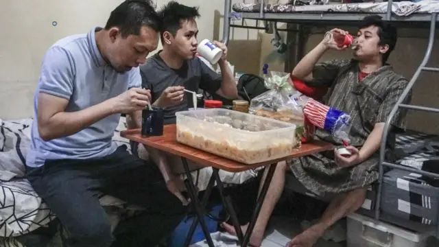 Young Filipino-Muslims prepare meal for iftar (fast-breaking) dinner during the first day of Muslim's holy month Ramadan inside their house as mosques are closed and public gatherings banned due to the coronavirus (COVID-19) pandemic in Manila