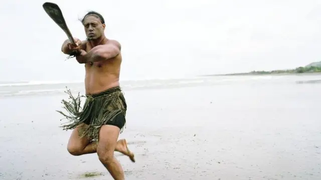 A Māori man performing a pōwhiri, welcome ceremony.