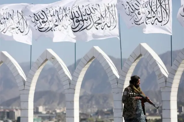 A Taliban fighter is seen at the Taliban flag-raising ceremony in Kabul, Afghanistan, March 31, 2022