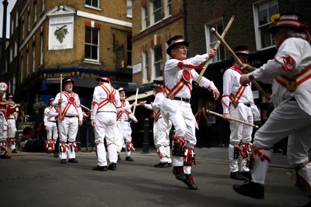 The Ewell St Mary's Morris Men dance at the Shepherd Market in London, as part of St George's Day celebrations on 23 April 2022