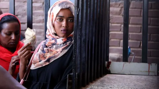 Sudanese buy bread from a bakery in the capital Khartoum - 11 October 2021