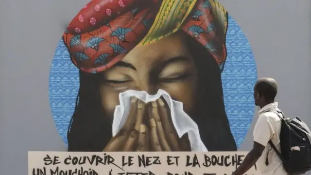 Street graffiti in Dakar asking people to cover their mouths when they sneeze
