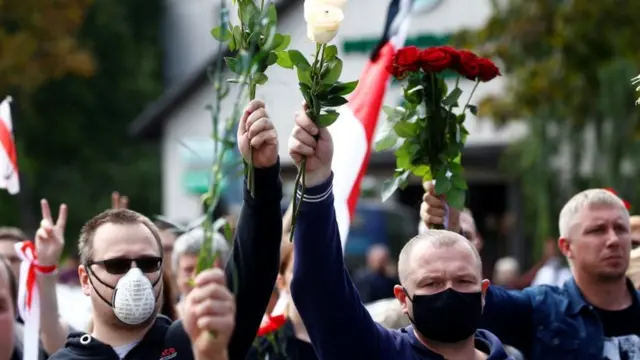 People attend a funeral ceremony on Saturday