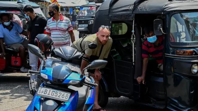 foreigners in fuel queues