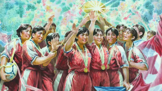 Cartaz de propaganda com a seleção feminina de futebol da Coreia do Norte.