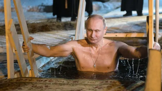 Vladimir Putin inside cold water
