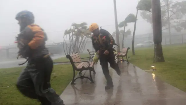 Emergency rescue teams in Puerto Rico running through a park