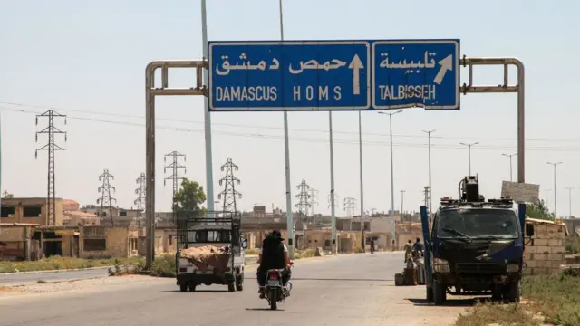 Direction sign for Homs and Damascus.