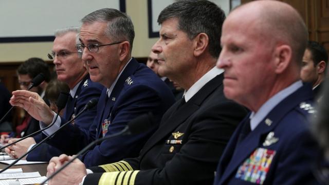 Gen John Hyten and other military figures address a Congressional hearing in March 2017.