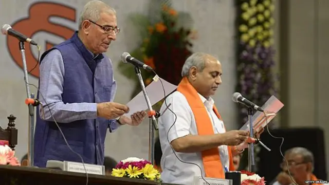 શપથ લઈ રહેલા નીતિન પટેલની તસવીર