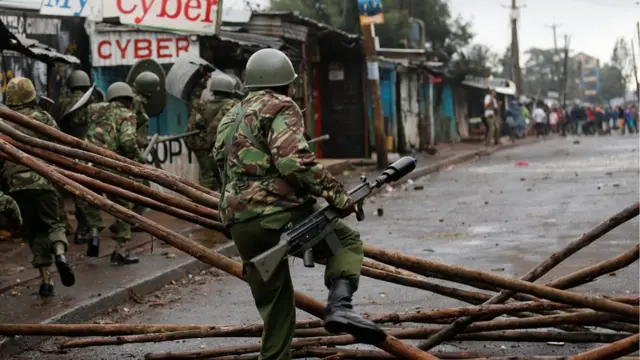 Riot police attempt to disperse supporters of Kenyan opposition leader Raila Odinga in the Kibera slums of Nairobi, 26 October 2017