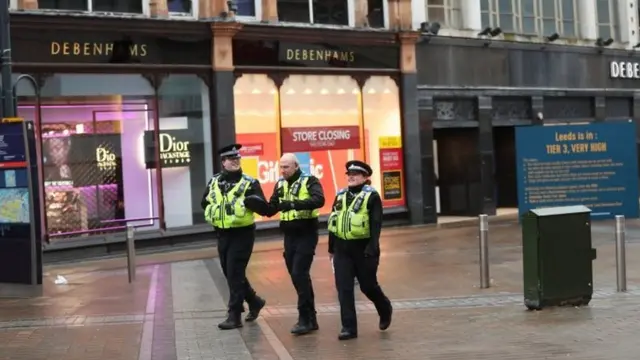 PCSOs patrol along Briggate in the city centre of Leeds, Yorkshire