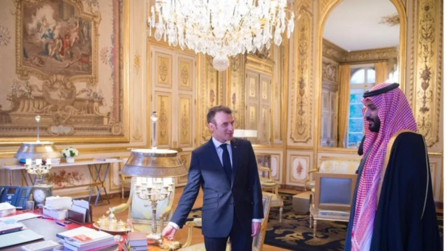 French President Emmanuel Macron pictured in 2018 with the owner of the Leonardo, Crown Prince Mohammad bin Salman