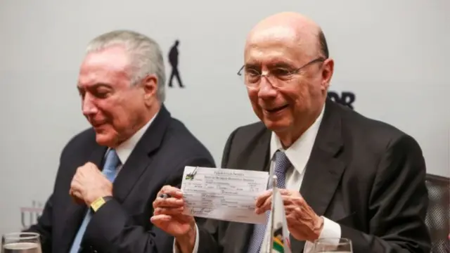 O presidente da República Michel Temer (esq.) e o ex-ministro Henrique Meirelles (dir.)