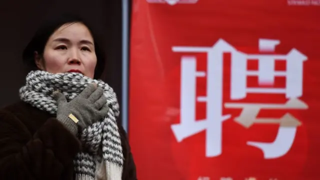 Job seekers are looking for suitable positions at a job fair for women in Fuyang, China, on March 6, 2024.