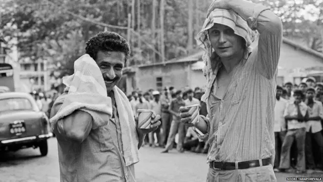 Naseeruddin Shah (left) and Stellan Skarsgard smiling on the sets of a film