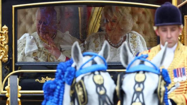 Britain's King Charles and Queen Camilla sit in Diamond Jubilee State Coach at Buckingham Palace on the day of coronation ceremony, in London, Britain May 6, 2023.