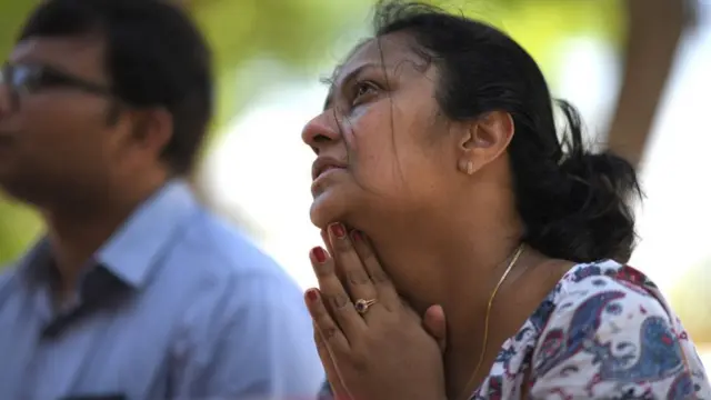 A woman prays at St Sebastian's Church in Negombo on April 22, 2019, a day after the church was hit in series of bomb blasts targeting churches and luxury hotels in Sri Lanka. - At least 290 are now known to have died in a series of bomb blasts that tore through churches and luxury hotels in Sri Lanka, in the worst violence to hit the island since its devastating civil war ended a decade ago. (Photo by Jewel SAMAD / AFP) (Photo credit should read JEWEL SAMAD/AFP/Getty Images)