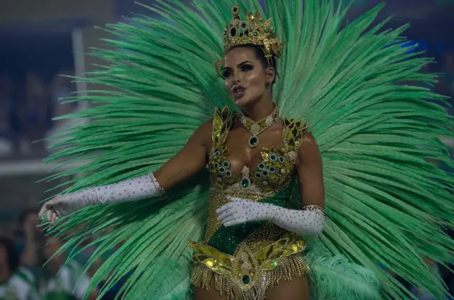 A reveller of the Imperatriz Leopoldinense samba school performs during the second night of Rio"s Carnival at the Sambadrome in Rio de Janeiro, Brazil, on February 13, 2018. / AFP PHOTO / Mauro PIMENTELMAURO PIMENTEL/AFP/Getty Images