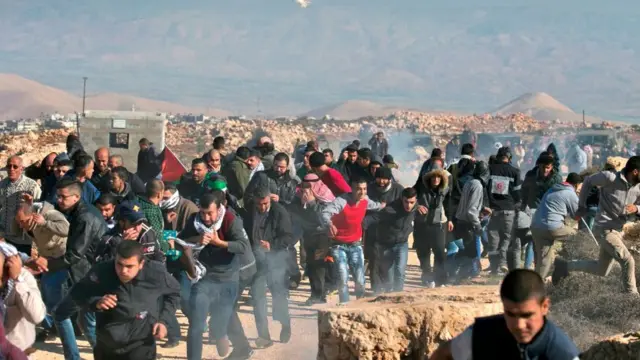 Palestinian protestors clash with Israeli security forces in Qusra village, south of the West Bank city of Nablus