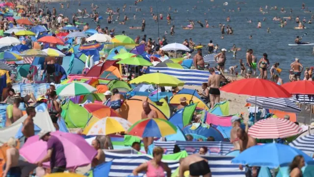 People crowd the beach at Zinnowitz on the island of Usedom in the Baltic Sea, northern Germany